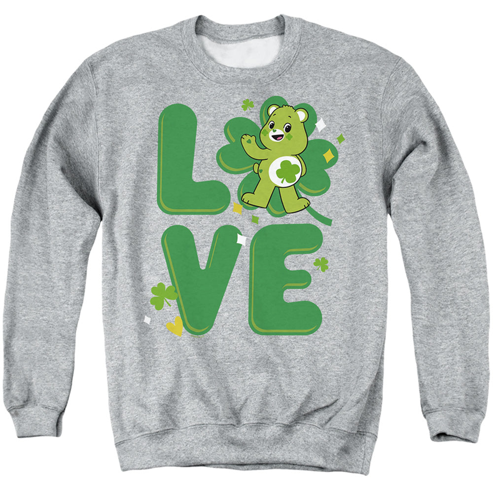 AN OFFCIALLY LICENSED CARE BEARS: UNLOCK THE MAGIC GOOD LUCK BEAR LOVE ST. PATRICK'S DAY ADULT UNISEX CREWNECK SWEATSHIRT ATHLETIC HEATHER