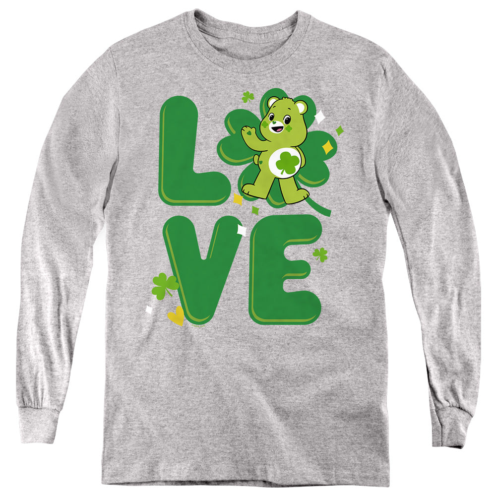 AN OFFCIALLY LICENSED CARE BEARS: UNLOCK THE MAGIC GOOD LUCK BEAR LOVE ST. PATRICK'S DAY YOUTH LONG SLEEVE T-SHIRT ATHLETIC HEATHER