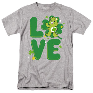 AN OFFCIALLY LICENSED CARE BEARS: UNLOCK THE MAGIC GOOD LUCK BEAR LOVE ST. PATRICK'S DAY MEN'S REGULAR FIT T-SHIRT ATHLETIC HEATHER