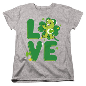 AN OFFCIALLY LICENSED CARE BEARS: UNLOCK THE MAGIC GOOD LUCK BEAR LOVE ST. PATRICK'S DAY WOMEN'S REGULAR FIT T-SHIRT ATHLETIC HEATHER