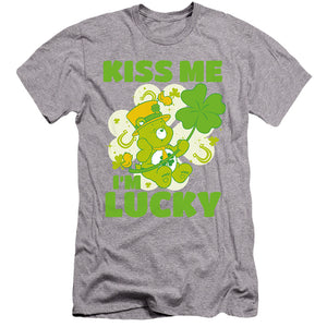 AN OFFCIALLY LICENSED CARE BEARS KISS ME I'M LUCKY ST. PATRICK'S DAY GOOD LUCK BEAR MEN'S PREMIUM SLIM FIT T-SHIRT ATHLETIC HEATHER