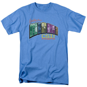 AN OFFCIALLY LICENSED CSI MIAMI GREETING FROM MIAMI MEN'S REGULAR FIT T-SHIRT CAROLINA BLUE