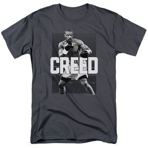 AN OFFCIALLY LICENSED CREED FINAL ROUND MEN'S REGULAR FIT T-SHIRT CHARCOAL